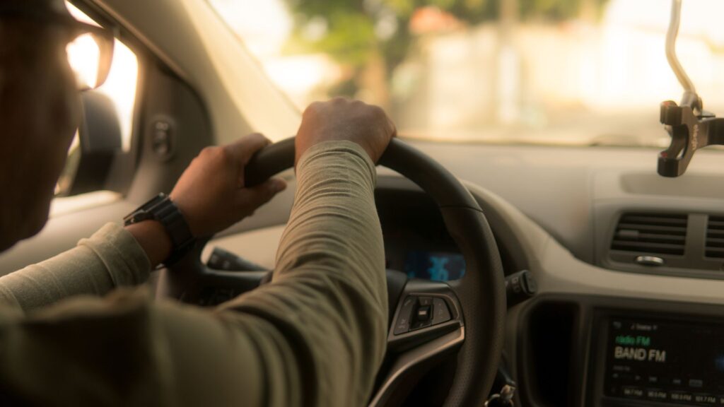 A person driving a car,