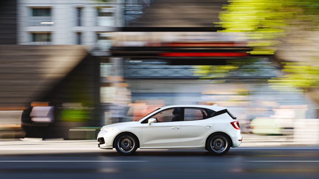 A speeding car through a city.