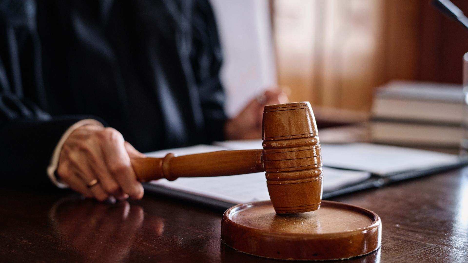 A judge banging their gavel.
